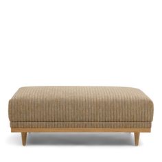 the footstool is made from wood and fabric