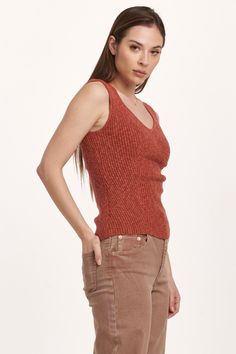 Decollete neck tank, verigated stretch rib finished with edge hem. Soft, cozy, versatile rib tee, the perfect blend for your lifestyle... Solid color knit fitted.Body length from HPS: 22 1/2", Sleeve length: N/A, Bust: 27" (Size Small) 58% COTTON 35% VISCOSE 7% SPANDEX Hand wash cold, Reshape dry flat Imported Sleeveless Ribbed Top For Layering, Sleeveless Tops With Ribbing For Layering, Everyday Ribbed V-neck Knit Top, Casual Seamless Knit Top For Layering, Fitted Casual Sweater Vest For Everyday, Ribbed Knit Tank Top For Layering, Ribbed Tank Top For Fall, Everyday Ribbed V-neck Tank Top, Fall Ribbed Tank Tops