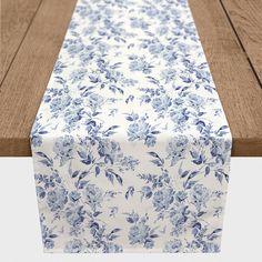 a blue and white floral table runner