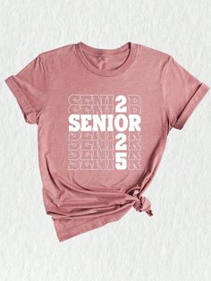 Celebrate the journey of the Class of 2025 with this vibrant and stylish Senior 2025 Shirt! ✨ Perfect for seniors who are ready to conquer the world and leave their mark. This shirt is not just a piece of clothing, but a symbol of hard work, perseverance, and accomplishments. Made with high-quality materials, this Class Of 2025 Shirt is designed to provide unmatched comfort and durability. The soft fabric ensures a cozy fit, allowing you to wear it all day long without any discomfort. It's the p College Shirt With Graphic Print In Pink, College Graphic Print Pink Shirt, Pink Graphic Print Shirt For College, Senior Class Shirts, Class Shirts, Class Of 2025, High School Graduation Gifts, Class Shirt, Senior Shirts