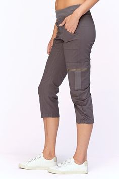 A stretch poplin crop with comfort & style. Features a pull on elastic waistband, two front pockets and two cargo zip pockets, clean back and style lines for added comfort. Stretch poplin body - 96/4 Cotton/Spandex 2x1 rib on waistband - 95/5 Cotton/Spandex Color description: Our favorite dark grey Waistband: 2" Elastic Inseam: 22" XS-XL Front rise: ~12" Back rise: ~20.5" 1X-3X Front rise: ~10" Back rise: ~15" Machine washable Preshrunk Imported MODELS Megan is wearing size X-Small Height: 5'10" Relaxed Fit Capris With Side Pockets, Capri Length Pants With Side Pockets, Stretch Capris With Pockets For Work, Stretch Capri Bottoms With Side Pockets, Sporty Cotton Cargo Pants For Work, Spring Utility Cargo Pants With Pull-on Style, Fall Workwear Capris With Pockets, Utility Style Pull-on Cargo Pants For Spring, Cropped Cargo Pants With Side Pockets For Fall