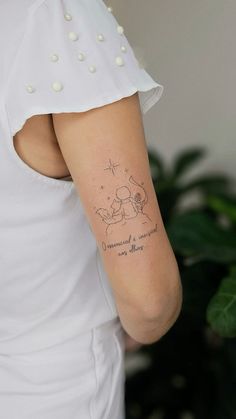 a woman with a small tattoo on her arm