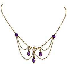 A stunning Antique Victorian - Edwardian Festoon Necklace with the most gorgeous gem quality Siberian Amethysts set in beautiful 14 Karat Gold with a Baroque Pearl accent. The antique necklace dates to circa 1870-1910. The Amethysts are pear shaped and round faceted gems of the finest royal purple color - just exquisite! The festoon swag necklace hangs beautifully around the neck. The gold is a luscious warm gold. A beautiful and rare jewel! The necklace is 14.25 inches long. The festoon portion Baroque Jewelry Victorian, Pisces Rising Aesthetic Clothes, Siberian Amethyst, Vintage Necklace Antiques, Regency Jewelry, Victorian Pendant Necklace, Baroque Jewelry, Festoon Necklace, Victorian Necklace