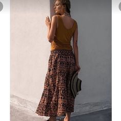 Size Large Nwt Free People All About Tiers Skirt. Pockets Elastic Waist Flat 17”, Length 34”. Very Flattering Fit And Waistband Has A Lot Of Stretch Due To Elastic. Casual Boho Print Long Skirt, Bohemian Brown Bottoms For Day Out, Brown Midi Skirt For Summer, Summer Brown Tiered Skirt Bottoms, Casual Boho Print Skirt, Bohemian Brown Bottoms For Vacation, Brown Tiered Skirt For Summer, Brown Long Skirt For Vacation, Brown Relaxed Fit Maxi Skirt For Beach