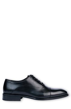 Handmade of smooth leather, this cap-toe dress shoe with a classic oxford silhouette offers a sophisticated, elegant look. Leather upper and lining/synthetic sole Made in Turkey Classic Oxford Lace-up Shoes With Rubber Heel Cap, Classic Cap Toe Business Lace-up Shoes, Classic Fitted Oxford Lace-up Shoes, Classic Plain Toe Lace-up Shoes, Classic Fitted Plain Toe Lace-up Shoes, Classic Fitted Lace-up Shoes With Plain Toe, Cap Toe Oxford Lace-up Shoes For Business, Classic Goodyear Welted Lace-up Shoes For Work, Classic Fitted Oxfords For Derby Events