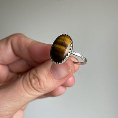 Handcrafted Sterling Silver Tigers Eye Cocktail Ring. This Ring Features A Shimmery Hammered Sterling Silver Band Set With A Genuine Tigers Eye Gemstone. The Tigers Eye Changes Color Depending On The Lighting This Ring Is A Size 9. Brand New, Never Worn And Handmade By Me! Tigers Eye Ring, Stackable Rings Silver, Costume Rings, Tigers Eye Gemstone, Hammered Sterling Silver, Ladies Diamond Rings, Luxury Rings, Rhinestone Heart, Zircon Ring