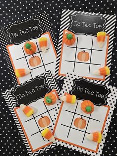 four halloween tic tac toe game cards with candy on them