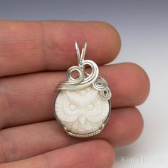 "This pendant is hand-crafted with 22 gauge sterling silver square wire, and a carved bovine bone (collected humanely) Owl cameo. The pendant measures 3/4\" x 1-1/4\". This is a made to order item; the item shown is a representation of what you will receive. The photo is enlarged to show detail. These cameos were hand-carved by one of the best bovine bone carvers in Bali, Indonesia. He has done a stunning job of capturing detail and the quality of the bone is exceptional. No two pieces are exact Handmade Sterling Silver Jewelry In Bone Color, Hand Cast White Sterling Silver Jewelry, Carved White Sterling Silver Necklaces, Cow Bones, Carved Bone, Sterling Silver Wire Wrap, Owl Pendant, Cabochon Ring, Bone Carving