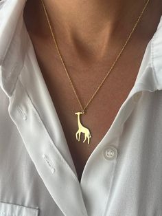 🦒Great gift for tall people🦒 Get this cute jewelry made with the high quality elements✨ You can go with 925K Sterling Silver with the options of Gold, Rose Gold or White Gold finish Beautiful jewelry for everyone 💙 Details * 925K Sterling Silver → 14K Gold, Rose Gold or White Gold plated * Chain length is approximately either 18 inches  / 45 cm or 22 inches / 55 cm 18 inches (16+2 in extender) / 45 cm (40+5 cm extender) 22 inches (20+2 in extender) / 55 cm (50+5 cm extender) * Time is important! You will receive your package as soon as possible 🚚 * We care about the quality of metal to make sure it will last for a long time * We use enamel technique to color the jewelry and high quality zircons only * There can be tiny differences on each item, length difference of the chain as well as Unique Gold Necklaces For Everyday Wear, Animal Design Jewelry Gift, Gold Animal Design Necklace For Gift, Gold Necklace With Animal Design For Gift, Giraffe Necklace, Animal Necklace, Tall People, Unisex Necklace, Minimalist Gifts