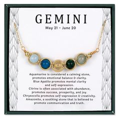 the gems necklace is on display in front of a card with information about its colors