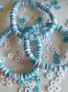 several blue and white beads on a table