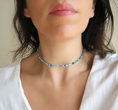 Seed Bead Choker, Beaded Necklace, Blue Necklace Mix turquoise, teal, navy blue, seafoam and aqua beaded choker necklace with glass tiny seed beads. DESCRIPTION Made from 2mm glass seed beads and closes with a silver plated clasp and 2 inches adjustable chain. SIZE Necklace is 13 inches and can be adjusted up to 15 inches with a 2 inches extender chain. Please let me know if you would like a different length. WRAPPING - All ZafireniaDainty jewelry arrive gift wrapped in a cute bag or box ready f Blue Beaded Choker With Faceted Beads, Blue Faceted Beads Choker Necklace, Blue Single Strand Choker For Gift, Blue Single Strand Choker As Gift, Adjustable Blue Gemstone Beads Choker, Blue Single Strand Choker With Round Beads, Beaded Necklace Blue, Dainty Necklace Layered, Seed Bead Choker