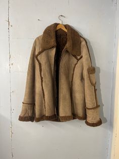 Lovely unusual faux Sherpa lined jkt .  . No labels present ! No pockets apart from 1 lovely arm pocket .. see pics . Heavy plastic zipper  There are some marks , slight stains on this garment ... see pics please . This does not distract from this cool - unique item .  Size L- XL  Pit to pit 24"(47") Length 33" Shoulder to Shoulder 19" Shoulder to cuff 28" See pics for all over condition Penny Lane Coat, Penny Lane, Sherpa Lined, Penny, Mens Jackets, Jackets & Coats, Unique Items Products