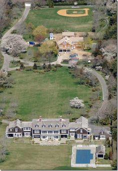 an aerial view of a baseball field and house