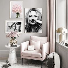 a living room with pink furniture and pictures on the wall above it's fireplace