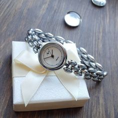 "Vintage women's small watch with a beautiful bracelet. The watch looks very elegant on a woman's wrist and goes well with other accessories. This watch perfectly captures the vintage style! The watch will be a great gift for lovers of vintage accessories. The watch is delivered in a beautiful box, so it is perfect as a gift. Peculiarities Brand \"Luch\" The mechanism is quartz. The clock has a battery installed. Made in USSR. Case diameter - 21 mm (0.8 in) Bracelet length - 19,5 cm (7.7 inches) Year of issue - 1990s Body color - silver Dial color - white Condition - vintage, the watch is about 40 years old, but in perfect condition. The clock works properly and shows the correct time. I will send the watch very quickly after purchase, as I am interested in you receiving your item as quick Elegant Analog Jewelry And Watches For Gifts, Analog Stainless Steel Jewelry And Watches As Gift, Elegant Bracelet Strap Watch As A Gift, Elegant Metal Bracelet As Gift, Silver Analog Jewelry And Watches As Gift, Elegant Metal Jewelry And Watches For Gifts, Silver Metal Watch As A Gift, Elegant Stainless Steel Watches As Gifts, Elegant Silver Watch For Gift