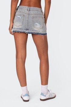 Online only! This Edikted denim mini skirt is the ultimate go-to piece for all your spring/summer plans. This classic staple with distressed detailing will go with everything in your closet, so you'll never be left wondering what to wear.


	Mini skirt
	Dual color distressed hem
	Distressed detailing
	Denim fabric
	100% Cotton
	Model wears size S
	Model height is 5'11
	Item care: Wash with similar color Cotton Denim Blue Skort With Frayed Hem, Denim Blue Cotton Skort With Frayed Hem, Trendy Light Wash Cutoff Mini Skirt, Trendy Ripped Mini Denim Skirt, Trendy Distressed Mini Skirt For Summer, Trendy Distressed Cotton Mini Skirt, Trendy Ripped Cotton Mini Skirt, Frayed Hem Denim Mini Skirt For Summer, Light Wash Denim Cutoff Mini Skirt