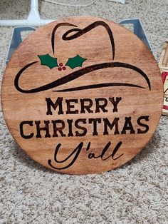 a merry christmas sign on the floor next to some crackers and an empty box