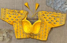 Stunning yellow heavy embroidery choli cut saree blouse. Buy designer blouse in USA from Pure Elegance. Disclaimer: The actual product may vary slightly from the image. These are custom orders, hence expect slight variation in color, placement of the motif or buta. ESTIMATED DELIVERYBecause this is a custom order, it would take about 4 weeks from the date of purchase. RETURN POLICY: This product is a custom order and cannot be returned or exchanged. Fitted Yellow Art Silk Embroidered Fabric, Fitted Yellow Embroidered Art Silk Fabric, Yellow Blouse Piece With Intricate Embroidery In Traditional Drape, Yellow Blouse Piece With Intricate Embroidery For Navratri, Yellow Blouse Piece With Intricate Embroidery, Yellow Art Silk Embroidered Fabric For Reception, Fitted Yellow Embroidered Fabric For Reception, Yellow Semi-stitched Blouse Piece With Intricate Embroidery, Semi-stitched Yellow Blouse Piece With Intricate Embroidery