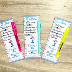 three children's bookmarks with writing on them