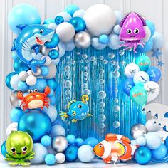 an ocean themed birthday party with balloons and decorations