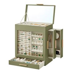 an open jewelry box filled with lots of rings