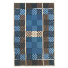 a blue and brown rug with squares on it