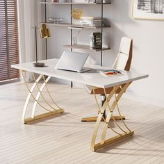 a desk with a laptop on it in front of a bookshelf and shelves