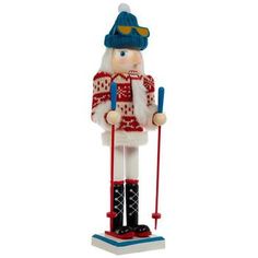 a nutcracker with skis and poles is standing on a white background,