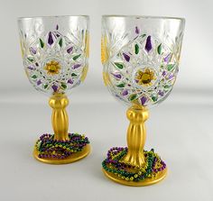 two glass goblets decorated with beads and jewels