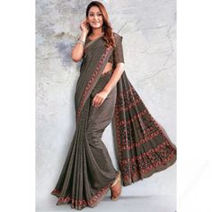 A stylish interpretation of ethnic glamour and contemporary style, this grey beige crepe saree will give you absolute perfection. This sweetheart neckline and half sleeve blouse is highlighted with printed work. It is paired with a crepe lightweight saree in grey beige color designed with printed work. This blouse can be customized up to the maximum size available in inches 44 around the bust. Slight color variation may occur due to photographic reasons. Grey Beige, Grey And Beige