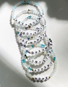 "A beautiful bracelet to display names of loved ones or words that are meaningful to you. These gem bracelets shimmer in the light and look so beautiful on! This bracelet is made with clear bicone crystal \"gem\" beads and 1 color gem bead of your choice. So many possibilities to make a bracelet that is unique to you!  Please indicate which ONE color gem and the name/ word you would like on your bracelet at checkout. At most, 2 color gem choices can be used (in place of clear) for this style bracelet. You can also choose if you would like gold or silver spacer beads. Filled or open heart bead options available too. Please refer to pictures for all color options :) I love jewelry that is personal and tells a story. Let me know how I can personalize pieces for you! - need a special size you Personalized Inspirational Silver Beaded Bracelets, Inspirational Personalized Silver Beaded Bracelets, White Crystal Bracelet With Letter Beads For Friendship, Clear Bracelet With Faceted Beads As Gift, Clear Bracelets With Faceted Beads As Gift, Clear Faceted Beads Bracelets As Gift, Clear Faceted Beads Bracelet As Gift, Clear Beaded Crystal Bracelet As Gift, Clear Beaded Bracelets For Gifts