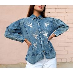 "80's Vintage Bleached Denim Shirt Glitter Embroidered Studded Collar, Button Up Blue Jean Shirt, Button Down Blue Denim Women's Top, Size M. - Size on the label: M. Fits sizes XS - M depending on fit (the model is 5'6\" and wears size S/EU36) - 100% cotton - In good vintage condition, some signs of wear MEASUREMENTS Bust 22\" Shoulders 18.5\" Sleeve length 19.5\" Length: back - 21\", front - 24\" The item will be shipped in 1-3 days after payment. Shipping usually takes 1 week (EU), 1-2 weeks ( Fitted Vintage Button-up Denim Top, Vintage Denim Button-up Top In Relaxed Fit, Fitted Denim Shirt For Spring, Medium Wash Floral Embroidery Button-up Top, Floral Embroidered Long Sleeve Denim Top, Vintage Button-up Denim Blue Jeans, Vintage Denim Blue Button-up Jeans, Vintage Fitted Button-up Denim Top, Embroidered Denim Blue Button-up Top