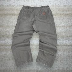 "Vintage Carhartt Carpenter Pants Chocolate Brown Canvas Baggy Fit Dungarees Work Wear Painters Leather Logo 90s Skate / Streetwear Great Condition: 7/10 (small marks, aka some character) Men's Size:  Waist: 38\" Length (inseam): 32\" Leg Opening: 9\" Thigh Opening: 14\" Front Rise: 14\"" 90s Style Cargo Pants With Pockets For Fall, 90s Style Bottoms With Pockets For Fall, 90s Style Relaxed Fit Pants With Pockets, 90s Relaxed Fit Pants With Pockets, Carhartt Carpenter Pants, Carhartt Carpenter, Skater Streetwear, 90s Skater, 90s Skate