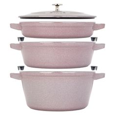 three pink casserole dishes stacked on top of each other in front of a white background