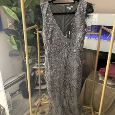 The Most Elegant Sequin Maxi Dress Glamorous Silver Sleeveless Midi Dress, Glamorous Silver Midi Dress For Gala, Glamorous Silver Midi Dress, Elegant Sleeveless Silver Midi Dress, Silver Midi Dress For Party Season, Elegant Silver Midi Dress For Party Season, Silver Sequin Midi Dress For Evening, Silver Sleeveless Evening Dress For Holiday, Glamorous Silver Midi Dress For Party Season