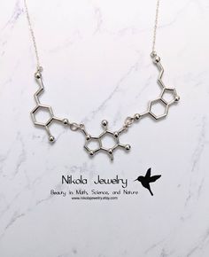 "This necklace was featured on Buzzfeed and BUST magazine (September 2015 issue Silver Serotonin Caffeine Dopamine Molecule Necklace I use the most gorgeous high quality sparkly sterling silver chain which makes this necklace as one reviewer says \"absolutely stunning.\" Keep this in mind when comparing similar products. The silver plated pendant measures 1.8 inches is width and included when I'm measuring the length of necklace selected. Purchase includes a molecule information card, a natural Chemistry Necklace, Dopamine Molecule, Biology Jewelry, Mine Quotes, Chemistry Jewelry, Molecule Necklace, Science Jewelry, Fancy Jewelry Necklace, Pretty Jewelry Necklaces