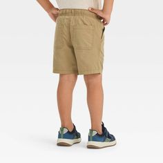 Get your little one ready to kick back, run and play in cute style with these Woven Solid Pull-On Shorts from Cat & Jack™. The mid-rise shorts are made from 100% cotton to keep your child in breathable all-day comfort, and the solid-color finish allows easy pairing with a variety of tops. The full elastic waistband with a front drawstring lets them find a secure fit, while the side and back pockets provide space for their tiny essentials. Cat & Jack™: Kids’ clothing with an imagination of its ow Mid Rise Shorts, Fabric Tape, Cute Style, Pair Of Pants, Cat & Jack, Body Measurements, Kids Clothing, Toddler Boys, Shoe Laces