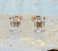 These gorgeous moissanite emerald cut earrings are a total of 4.00ct. Each stone measures 8x6mm and are D color, VVS clarity. The mountings have beautiful fluer de lis detailing and are perfect for everyday wear. The earrings are available in sterling silver, and 14k white, yellow or rose gold. All items are handmade by me in my shop in Woodbridge, NJ. Please message me with any questions. Shipping within the United States is complimentary. Thank you for exploring my shop! Emerald Cut Earrings, Fluer De Lis, Ruby Ring Gold, Earrings Emerald, Cut Earrings, Emerald Cut Moissanite, Ruby Engagement Ring, Morganite Engagement, Moissanite Earrings