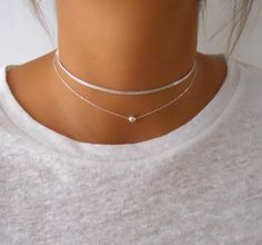 "Sterling silver set of 2 necklaces - Chain choker + Bead necklace The necklaces are separated so each can be worn on its own or layered with other necklaces. ⊹ L e n g t h 13\" + 3\" extender chain for both necklaces. ⊹ D e t a i l s * Choker: Sterling silver chain Sterling silver spring clasp and links * Bead Necklace: Sterling silver chain 5 mm Sterling silver bead ⊹ Read about my shop Processing and Delivery times, Payment options, Packaging and Care instructions here: https://www.etsy.com/i Short Silver Necklace, Silver Necklace Simple, Sterling Silver Choker, Silver Choker Necklace, Silver Choker, Gold Necklace Set, Simple Necklace, Chain Choker, Silver Bracelets