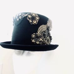 Sometimes that touch of eccentricity is just what you need to set yourself apart from the crowd and nothing will let you do so better than a great head topper, one like this Neo-Victorian top hat. Combining a vintage Victorian style with the mechanical aesthetic of steampunk, this unisex top hat is fitted with a variety of Victorian vintage baubles and fantastical cogs & gear ornaments on a formed Felt hat with with Ribbon Band. Choosing the custom theme Hat option? Whether you are a high-so Mechanical Aesthetic, Elegant Face Mask, Vintage Baubles, Victorian Top, Women Steampunk, Black Steampunk, Steampunk Top, Steampunk Top Hat, Metal Mask