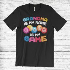 a black t - shirt with the words grandma is my name, boobo is my game on it