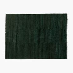 a dark green rug on a white background