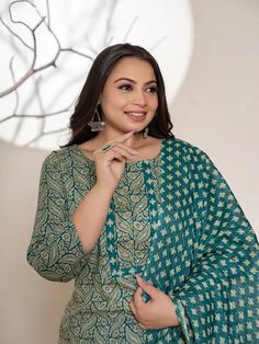 This 3-piece set includes teal green cotton ethnic motif print, beads & stone detailing straight shape kurta has round neck, 3/4th sleeves, straight hem, calf length teamed with printed trouser pants has elasticated waistband & slip on closure with single pocket and a voile dupatta. The model wearing the size small is 5'8 in height. 3 Piece Set Color-Teal Green Kurta Fabric- Cotton Bottom Fabric - Cotton Dupatta Fabric-Voile Work - Ethnic Motif Print, Beads & Stone detailing Neck - Round Neck Sl Cotton Sets With Motifs, Straight Kurta, Cotton Palazzo Set With Motifs For Diwali, Green Bohemian Salwar Kameez In Mulmul, Festive Green Bohemian Unstitched Suit, Green Long Sleeve Cotton Churidar, Traditional Green Unstitched Suit With Printed Motifs, Green Salwar Kameez With Printed Motifs, Green Straight Kurta Sets With Printed Motifs, Green Cotton Sets With Zari Work