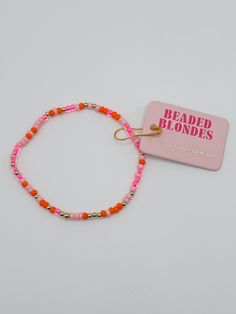 Add some fun to your ensemble with the Pink and Orange Sprinkle Bracelet! Perfect for adding some flair to any look! Made with 14 K gold filled tarnish proof beads and durable elastic string. Trendy Nickel-free Beaded Bracelets With Round Beads, Trendy Nickel-free Round Beaded Bracelets, Trendy Gold Hand-strung Friendship Bracelets, Trendy Hand-strung Gold Friendship Bracelets, Pink Seed Bead Bracelet, Tiny Bead Bracelet, Beaded Necklace Diy, Necklace Diy, Bead Bracelets