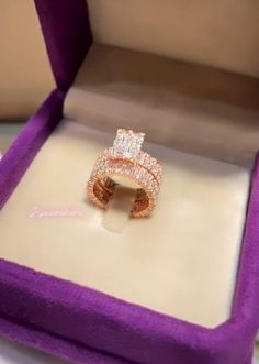 a diamond ring in a purple velvet box