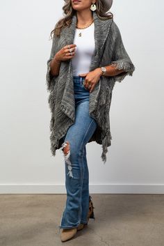 Conquer the unknown with our Adaline Knit Collared Cardigan/ Ruana. This luxurious, fashionable staple will keep you warm and stylish with its knit design and trendy fringe detail. Add a touch of boldness to your wardrobe and embrace the risk-taker within you! One Size Fringe Sweater For Fall, Cozy Fringe Cardigan For Fall, Knit Outerwear With Fringe For Fall, Knit Fringe Outerwear For Fall, Fringe Cardigan For Fall Layering, Fringe Cardigan For Fall, Long Sleeve Knit Outerwear With Fringe, One Size Fringe Cardigan For Fall, Knit Long Sleeve Outerwear With Fringe