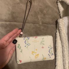 Never Used Coach Flower Wristlet. Super Cute. Coach Flower Bag, Spring Gift Wristlet With Wrist Strap, Spring Rectangular Wristlet With Wrist Strap, Spring Rectangular Wristlet, Coach Spring Pouch Wallet, Coach Pouch Wallet For Spring, Beige Rectangular Wristlet For Spring, Pink Wristlet For Everyday Use In Spring, Rectangular Beige Wristlet For Spring