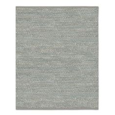 an area rug with grey and white colors