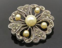 "925 Sterling Silver - Vintage Pearls & Marcasite Floral Brooch Pin - BP5163  925 Sterling Silver - Vintage Pearls & Marcasite Floral Brooch Pin - BP5163  Jewelry Type:         Brooch Pin  Metal Type:            925 Silver  Metal Size:             1.5\"  Stone Type:            Pearls & Marcasite   Condition:              N/A  Jewelry Weight:     11.7 Grams  PLEASE NOTE: THIS ITEM IS PRE-OWNED. ALTHOUGH MOST ITEMS ARE IN VERY GOOD CONDITION, SOME MAY NEED CLEANING AND/OR MINOR REPAIRS. WE MAKE A VERY STRONG EFFORT TO UPLOAD CLEAR PICTURES. PLEASE INSPECT ALL PICTURES AND ASK ALL QUESTIONS YOU MAY HAVE PRIOR TO MAKING A PURCHASE. NOT ALL STONES ARE GENUINE, SOME ARE ENHANCED OR CREATED." Silver Art Deco Brooches For Wedding, Silver Art Deco Wedding Brooches, Silver Costume Jewelry Brooches For Formal Occasions, Silver Art Deco Wedding Brooch, Silver Costume Jewelry Brooch For Formal Occasions, Silver Victorian Brooches For Vintage Events, Silver Victorian Brooch For Vintage Events, Victorian Silver Brooch For Vintage Events, Vintage Sterling Silver Brooches For Wedding